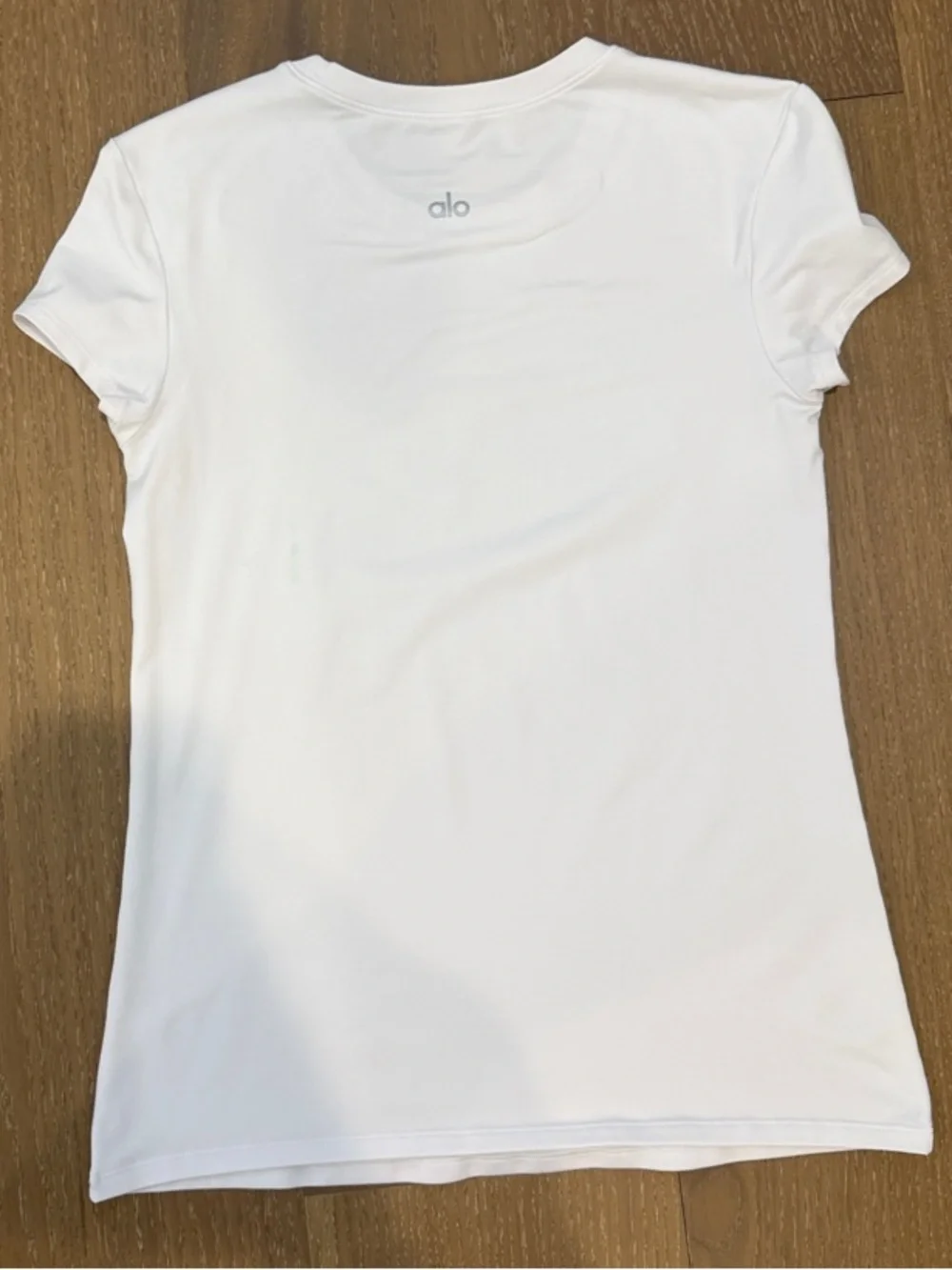 ALO Yoga White Short-Sleeve Crewneck Tee. Small stain on back.